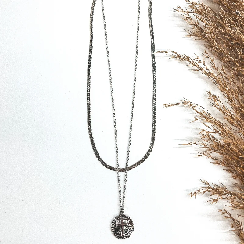 Layered Herringbone Chain Necklace with Circle Sunburst Cross Pendant in Silver Tone