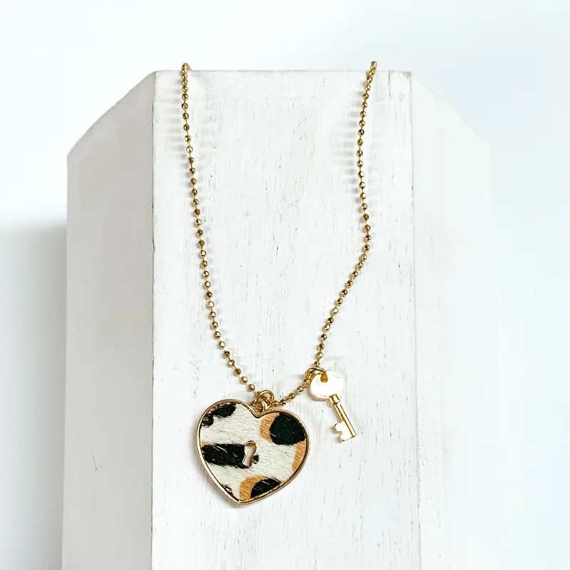 Key to My Heart Gold Tone Necklace with Gold Tone Key Charm and White Leopard Print Heart Pendant